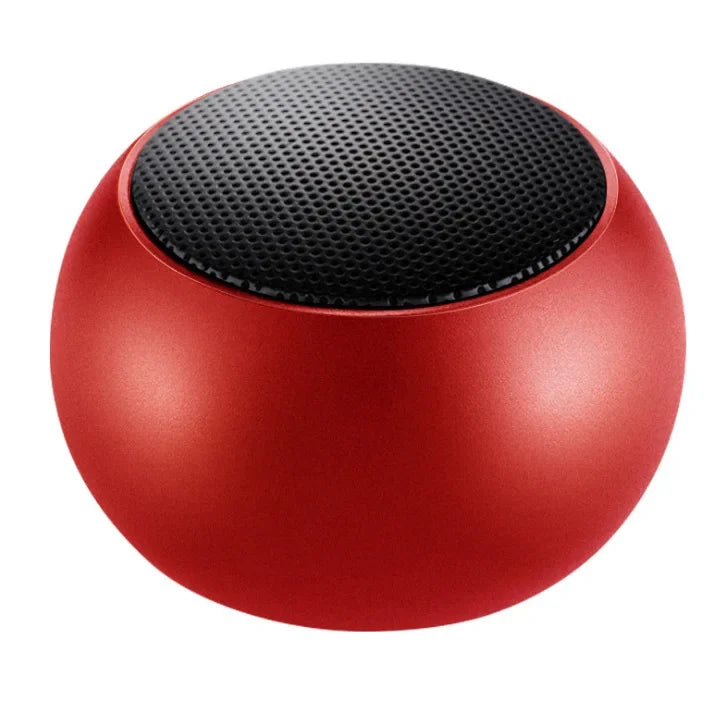 Small Bluetooth speaker in hand showing compact size